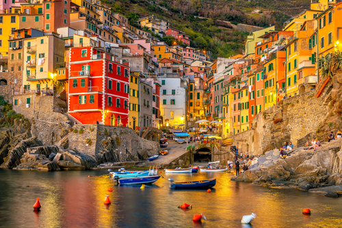 View of the harbor of Riomaggiore, Colorful cityscape on the mountains over Mediterranean sea in Cinque Terre, Luguaria Italy