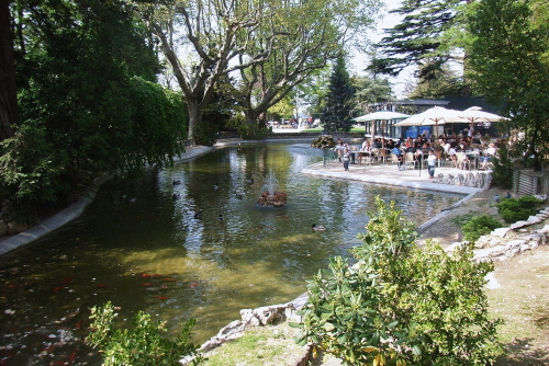 View of the pond in the park with a resting spot on the rocky outcrop of Rocher des Doms which overlooks the city of Avignon, Provence, France