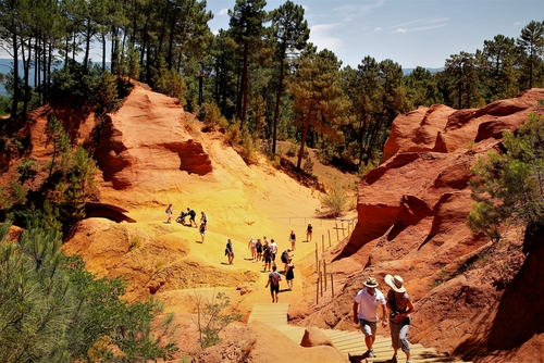 Tourists experienced the geology of red clay in Roussillon, Provence, France