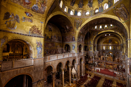 St Mark's Basilica (San Marco) in Venice, Veneto, Italy. It is famous tourist attraction of city, World landmark. Interior of San Marco cathedral, painting and mosaic inside old temple