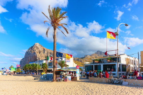 View of the Beach and its restaurants in San Vito lo Capo at the Mediterranean sea, Sicily, Italy