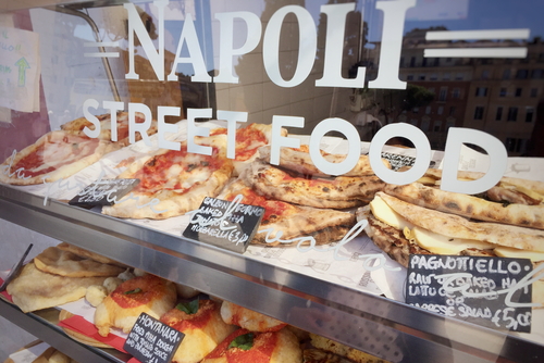 Neapolitan Street food stand with Calzone fritto, Pagnottiello and Pizza among the traditional dishes offered for sale, Naples, Campania, Italy