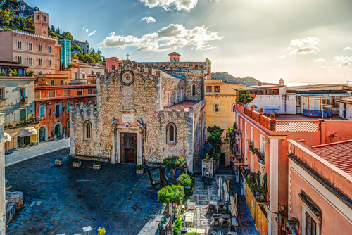 Aerial view of the Duomo in Taormina, the most popular Sicilian attraction, townscape of Taormina with cathedral, square and the hill with other buildings, Sicily, Italy