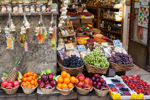 Antique grocery exposing good quality fruit for sale in Siena, Tuscany, Italy