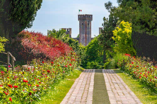 View of parco giardino Sigurta gardens with the Castle of Valeggio sul Mincio on the background near Verona, Veneto, Italy