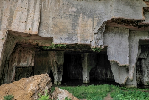 Ear of dionysus and the Cave of the Nymphaeum (Grotta del Ninfeo) an artificial cave near the Greek Roman theater in Syracuse, Italy