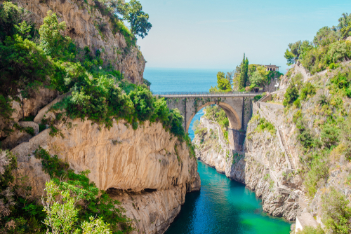 View of the Famous fiordo di furore beach seen from bridge, view of Furore creek, near Sorrento, Amalfi coast, Campania, Italy