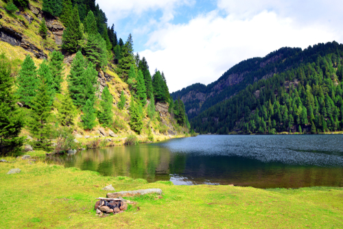 Mountain landscape with lake. Lago Lagorai in Dolomite Alps, Val di Fiemme, South Tyrol, Italy