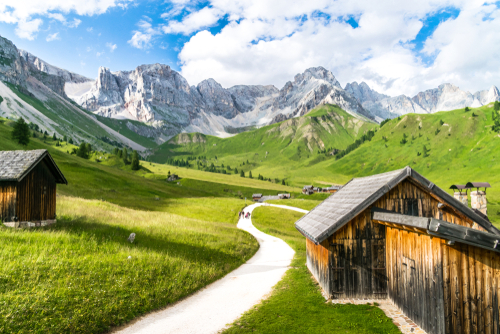 Val di Fassa during summer season, fuciade chalet during summer and panorama of Dolomites, Trentino Alto Adige, Italy