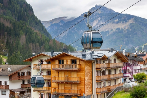 Cable car cabin, summer view of Canazei, Italy village in Fassa valley in Trentino Alto Adige