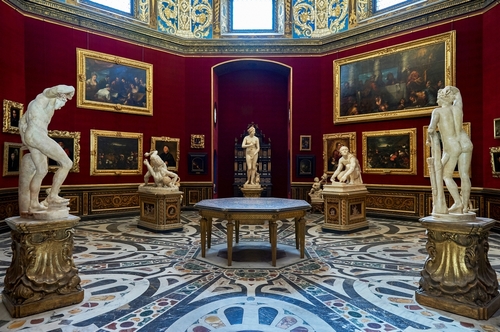 Beautiful interior view of sculptures and paintings at the Uffizi Gallery Museum in Florence, Tuscany, Italy