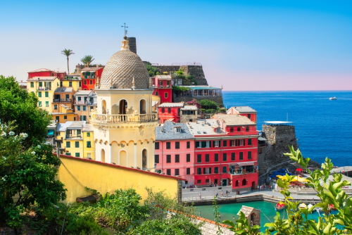 Color view of the houses and church tower at the picturesque town of Vernazza, Cinque Terre National Park, Liguria, Italy
