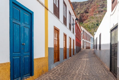 Colored doors and windows to the streets in the village of Agulo in the north of La Gomera Island in Summer, Canary Islands, Spain