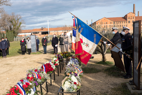 World War II veterans raise the French flag at the Holocaust remembrance ceremony at Camp des Milles, Provence, France