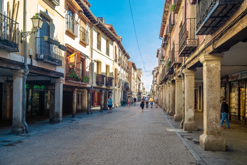 People walking through the streets of Alcala de Henares, near Madrid, Spain
