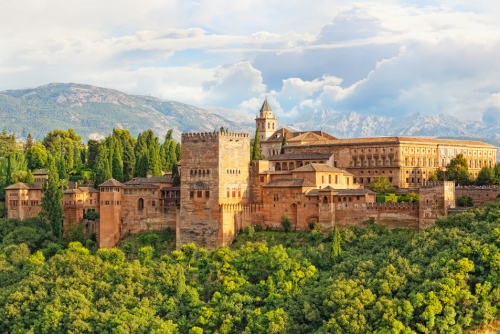 View of the Moorish Alhambra fortress among the green trees, Granada, Andalusia, Spain
