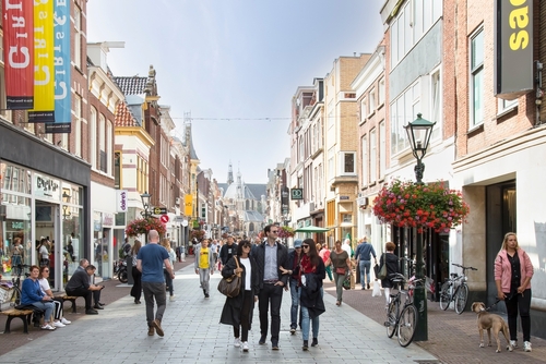 Many people shopping at a street at the center of Alkmaar, Holland