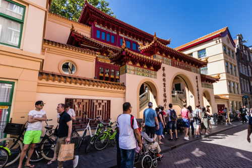People entering Fo Guang Shan Holland Tempel (He Hua Tempel) in Chinatown, Amsterdam, Holland