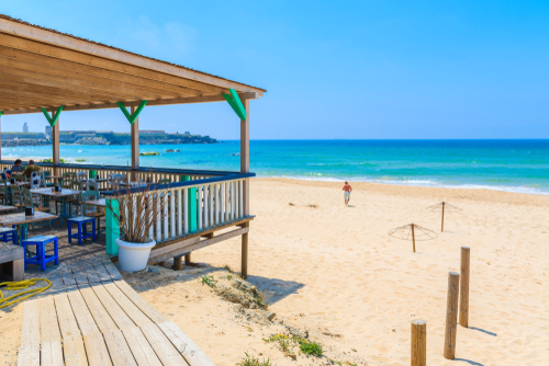 Restaurant terrace on sandy Tarifa beach, Costa de la Luz, Andalusia, Spain