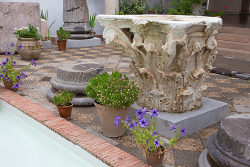 The Corinthian capital of ancient rome column in atrium of Archeological museum of Cordoba, Andalusia, Spain