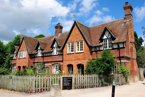 Red brick and half-timbered residential building in the village of Avebury, the Cotswolds, Gloucestershire, England, UK
