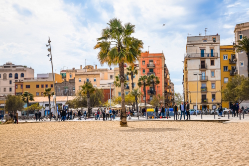 View of people and the beach at La Barceloneta district, Barcelona, Catalonia, Spain