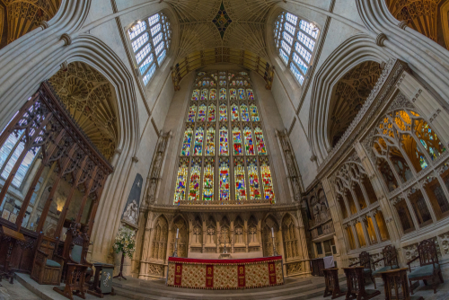 Interior view of the magnificent stained-glass at the Abbey Church of St. Peter and St. Paul, commonly known as Bath Abbey in Bath, Somerset, England, UK