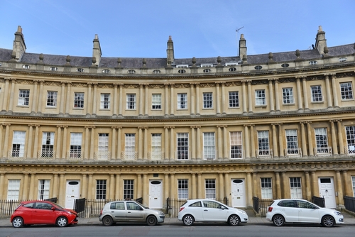 The landmark Royal Circus is seen on a city centre street in Bath, Somerset, England UK. The Circus comprises of luxury Georgian era town houses in a prime location
