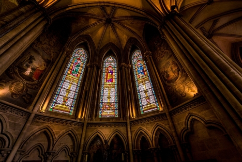 Notre Dame Cathedral Interior, gothic church built in 1862. With huge columns and archs. Nice tones and dark light, spiritual place. Bayeux, Normandy, France