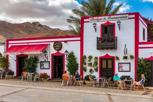 People dining in a colorful restaurant in the old town of Betancuria, Fuerteventura Island, Canary Islands, Spain