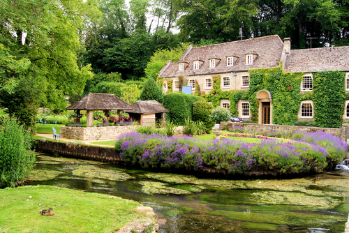 Picturesque garden in the Cotswold village of Bibury, Gloucestershire, The Cotswolds, England, United Kingdom