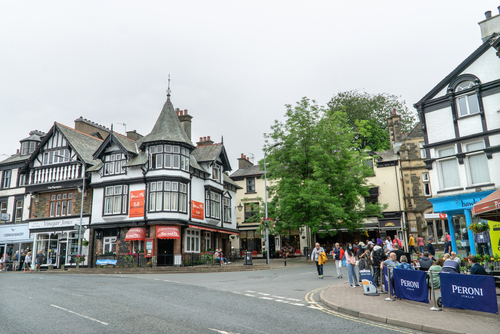 View of Bowness High Street shops and restaurants, Lake Windermere, Lake District National Park, Cumbria, England, UK