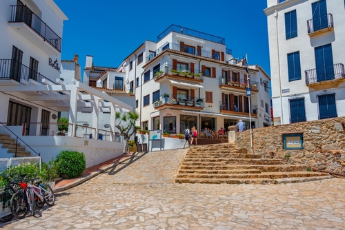 Whitewashed street at Spanish village Calella de Palafrugell, Costa Brava, Catalonia, Spain
