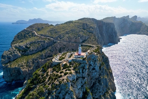 Aerial view of the Cap de Formentor from the sea with an amazing view of the lighthouse at the edge of the Cap, Mallorca Island, Balearic Islands, Spain