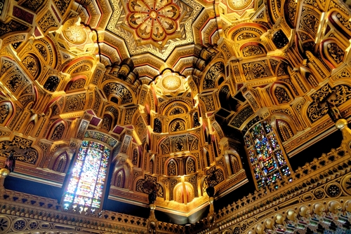 The interior of the circular Arab Room with its amazing gold, gilded, carved ceiling. Cardiff Castle in Cardiff, Glamorgan, Wales, UK