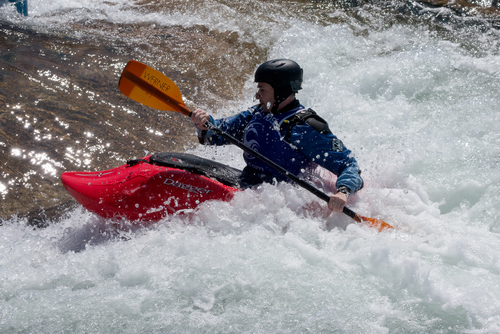 Person in a Kayak at the Cardiff International White Water Centre in Cardiff, Wales, UK