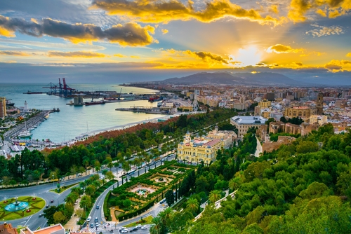 Aerial view of Malaga taken from Gibralfaro castle including port of Malaga, Alcazaba castle and the cathedral of Malaga during Sunset, Andalusia, Spain