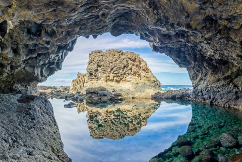 Beautiful view of a volcanic Cavern at beach Charco Azul, El Hierro island, The Canaries, Spain