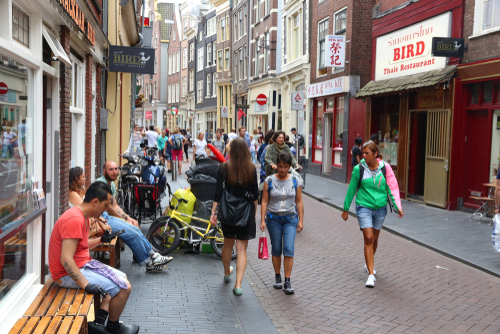 People visiting Zeedijk restaurant street in Amsterdam's Chinatown, Netherlands