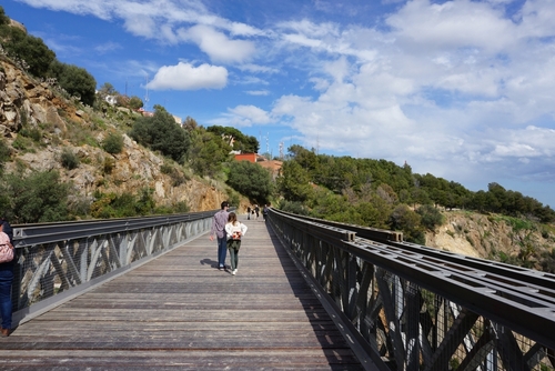 View of people walking across a pathway at the Natual Park of Collserola in Barcelona, Catalonia, Spain