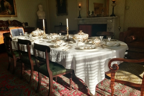 Dining room with decorative on the table of the history of science, Down House, the home of Charles Darwin where Darwin wrote 'On the Origin of Species', Kent, England, United Kingdom