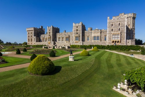 Exterior view of Windsor castle and its beautiful gardens on a clear sky day near London, England, UK