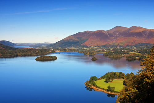 A view across Derwentwater with Skiddaw, the fourth highest mountain in England in the Background, the Lake District National Park, Cumbria, England, UK
