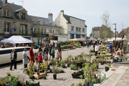 A busy street scene on market day, Domfront en Poiraie, Normandy, France
