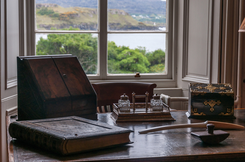 Ancient writing desk in Dunvegan Castle, residence of the MacLeod clan family, Isle of Skye, Scotland, UK