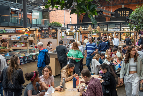 Food stalls inside Spitalfields Market, a popular market with food, bars, arts and crafts in London, England, United Kingdom