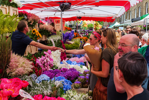 Columbia Road Flower Market with unidentified people, it is a popular historic street market in the London Borough of Tower Hamlets in London, England, UK