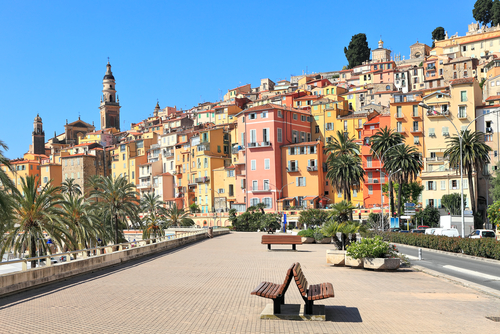 View of promenade and old medieval town with multicolored houses of Menton, French Riviera, France