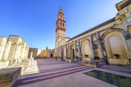 Panoramic view of the church of San Juan with its tower of impressive architecture in the monumental city of Ecija, Andalusia, Spain