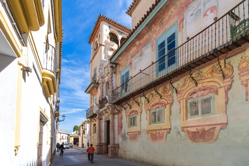 View of the colorful Palacio de Penaflor in Ecija, Andalusia, Spain